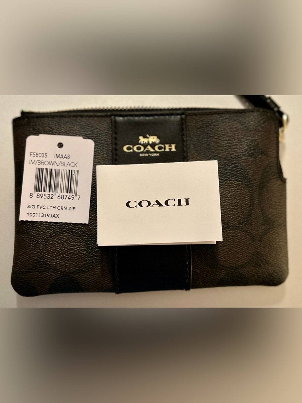 Coach Brown and Black Signature PVC Leather Wristlet